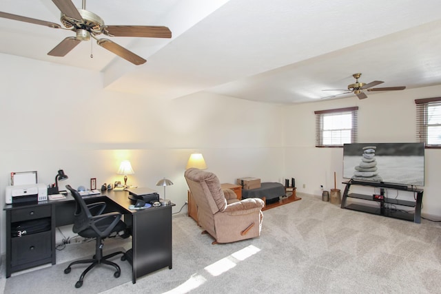 carpeted office featuring ceiling fan