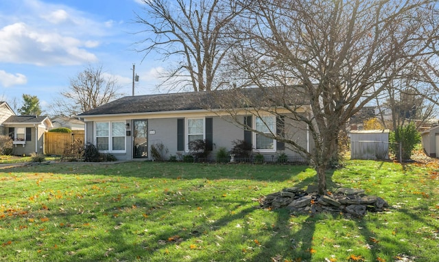 ranch-style home with a front yard