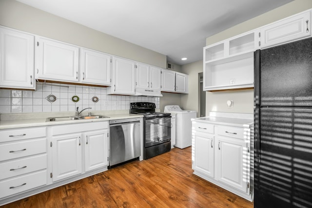 kitchen with black refrigerator, stainless steel dishwasher, sink, electric stove, and white cabinets