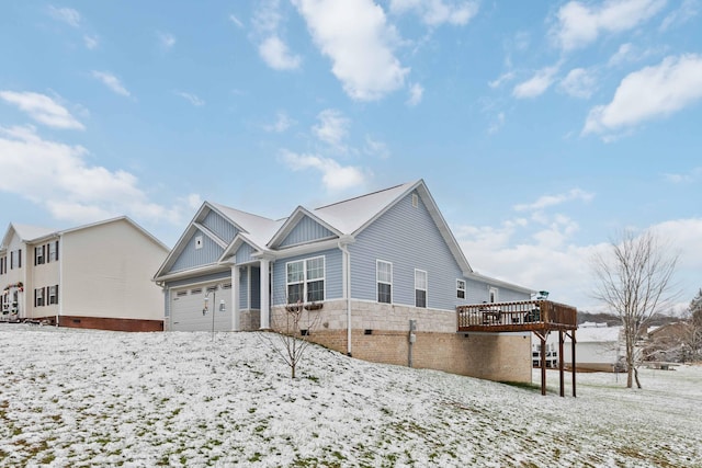 exterior space featuring a garage and a deck