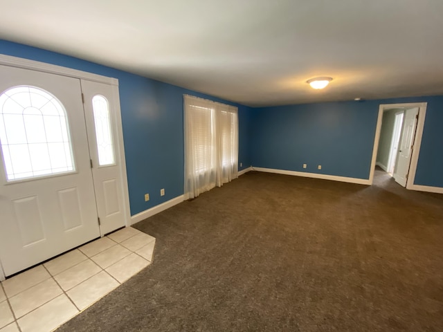 entrance foyer featuring light carpet