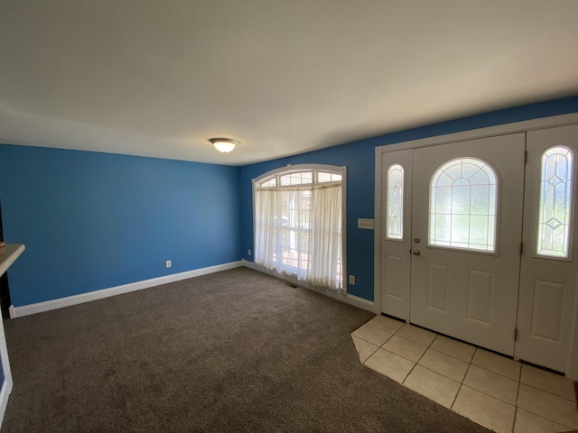 view of carpeted foyer