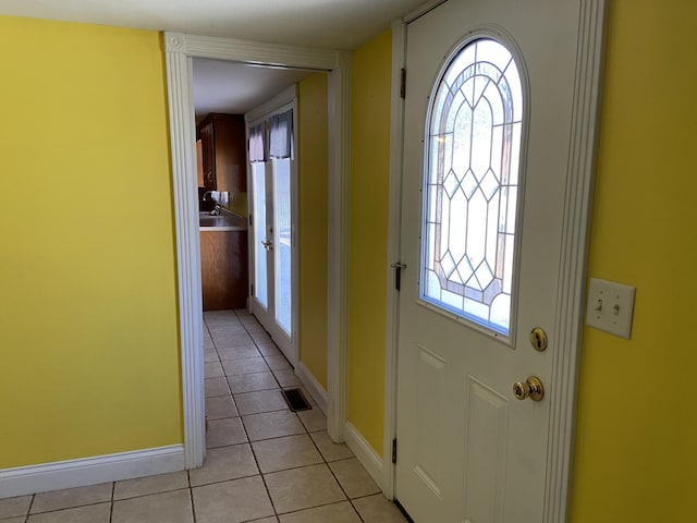 entryway featuring light tile patterned floors