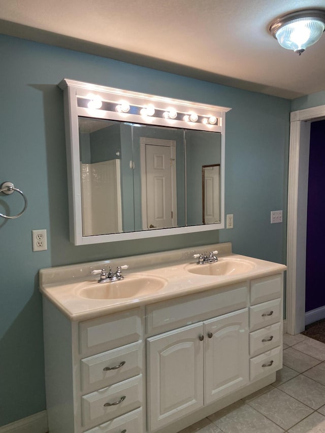 bathroom featuring tile patterned floors and vanity