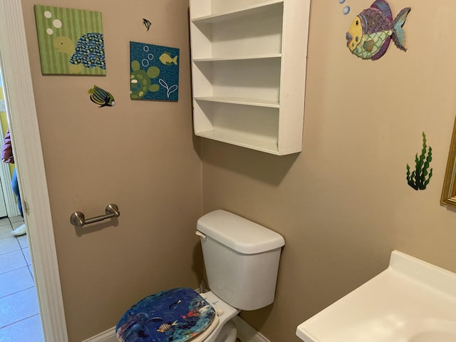 bathroom featuring tile patterned floors and toilet