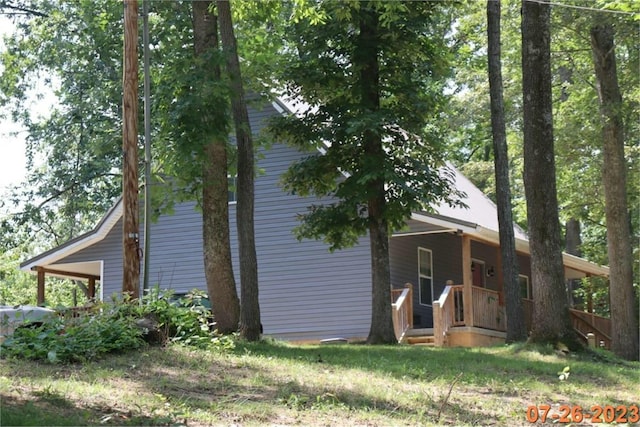 view of home's exterior with covered porch