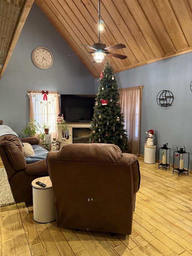 living room featuring ceiling fan, high vaulted ceiling, light hardwood / wood-style floors, and wooden ceiling