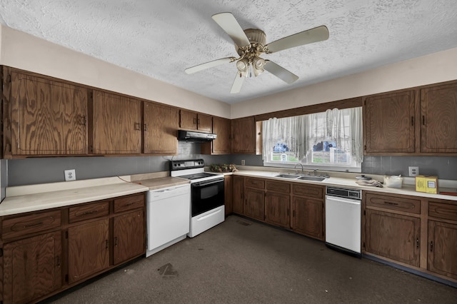 kitchen with white appliances, sink, ceiling fan, a textured ceiling, and dark brown cabinetry