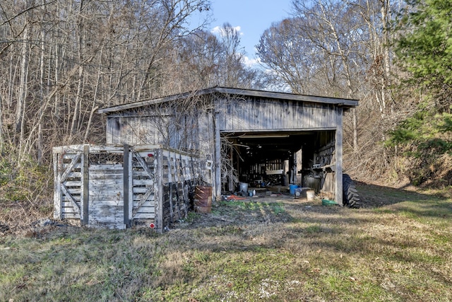 view of outbuilding with a lawn