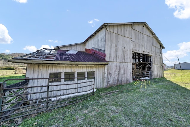 view of outbuilding with a lawn