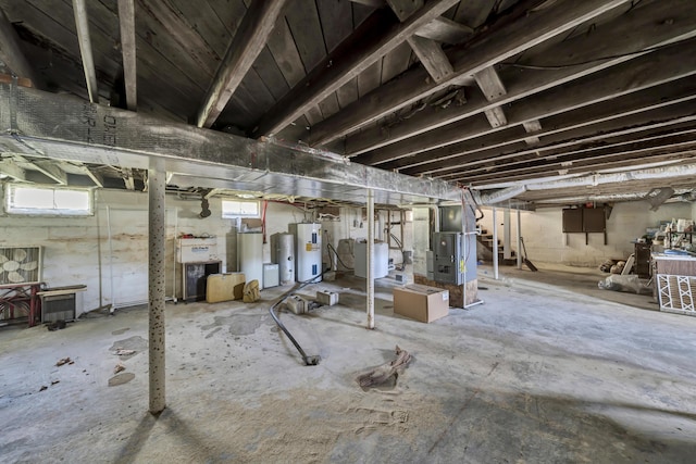 basement featuring heating unit and water heater