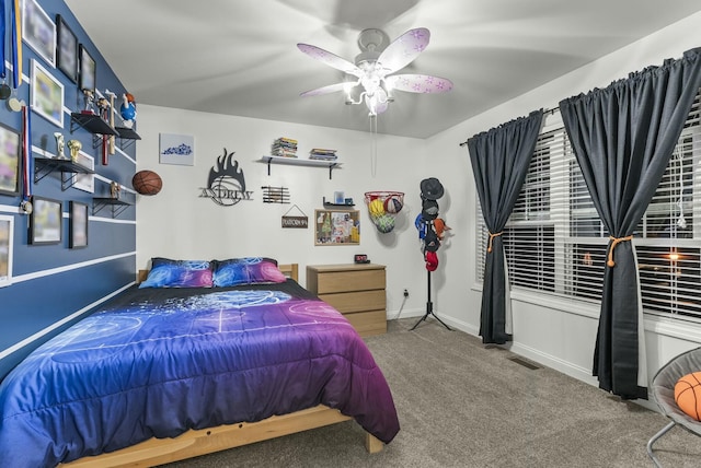 bedroom with ceiling fan and carpet floors