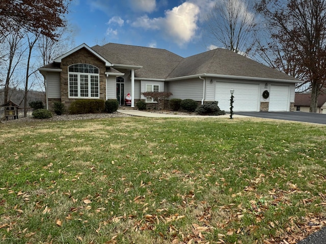 ranch-style home featuring a garage and a front lawn