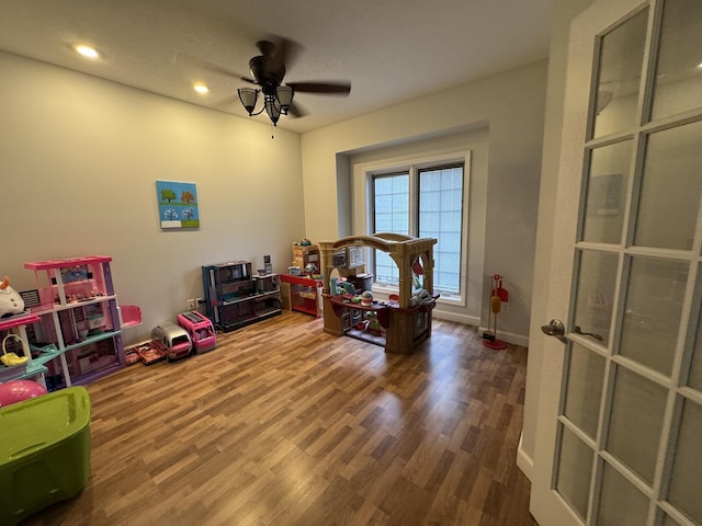 bedroom with hardwood / wood-style flooring and ceiling fan