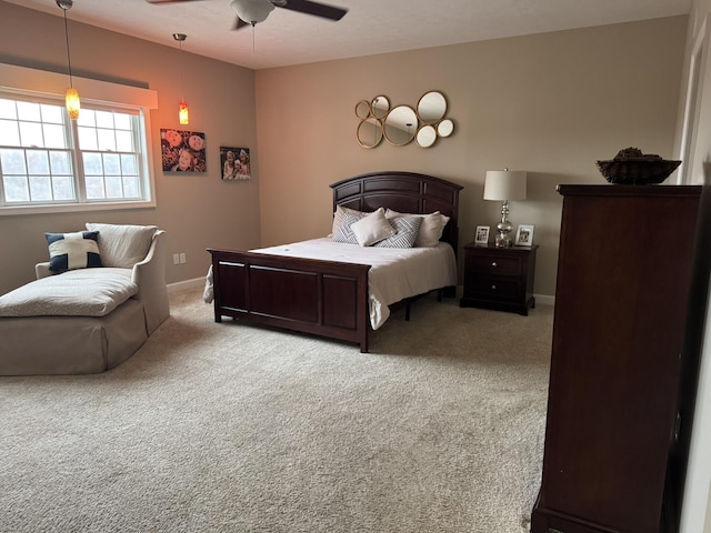 bedroom with light colored carpet and ceiling fan