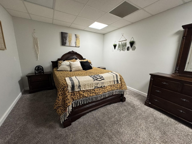 carpeted bedroom with a paneled ceiling