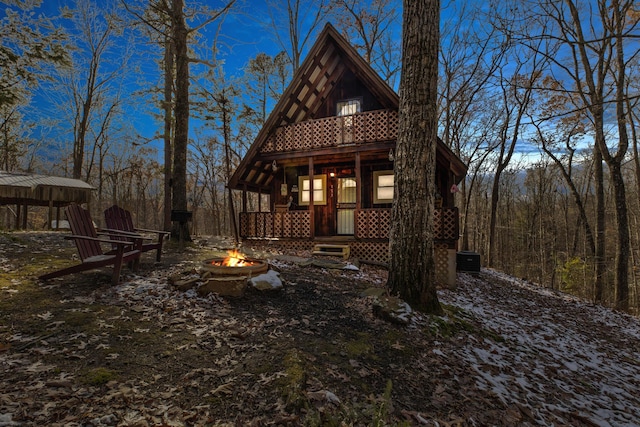 view of front of home with a fire pit