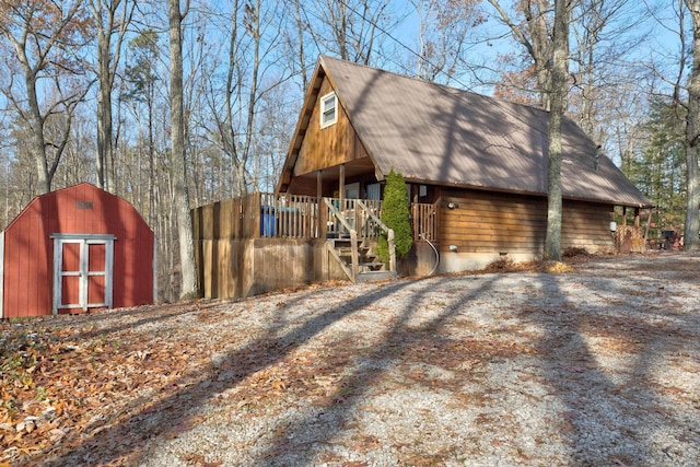 view of side of property featuring an outbuilding