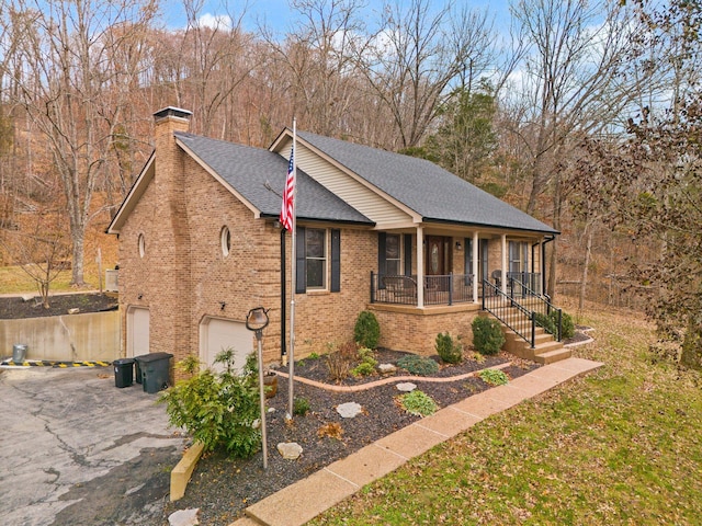 view of front facade with a porch and a garage