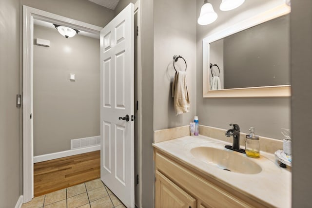 bathroom featuring hardwood / wood-style floors and vanity