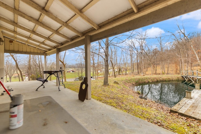 view of patio with a water view