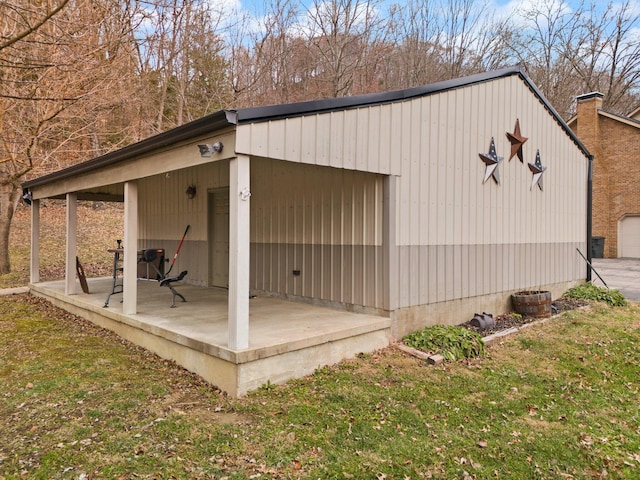 view of outbuilding with a lawn