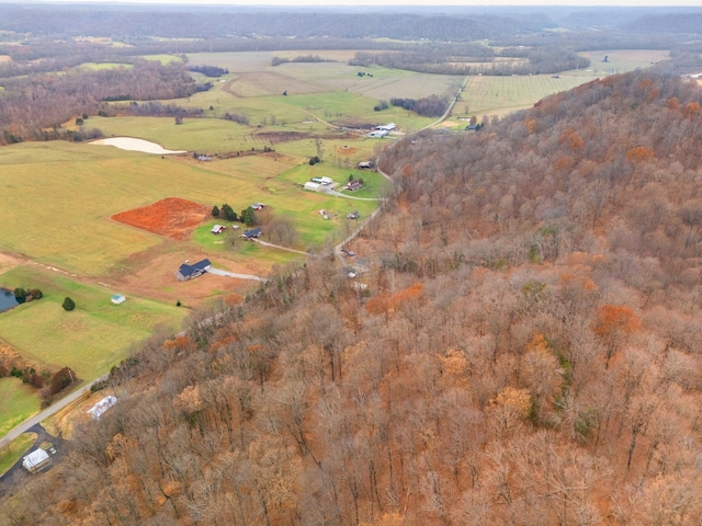 birds eye view of property with a rural view