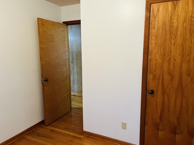 unfurnished bedroom with light wood-type flooring