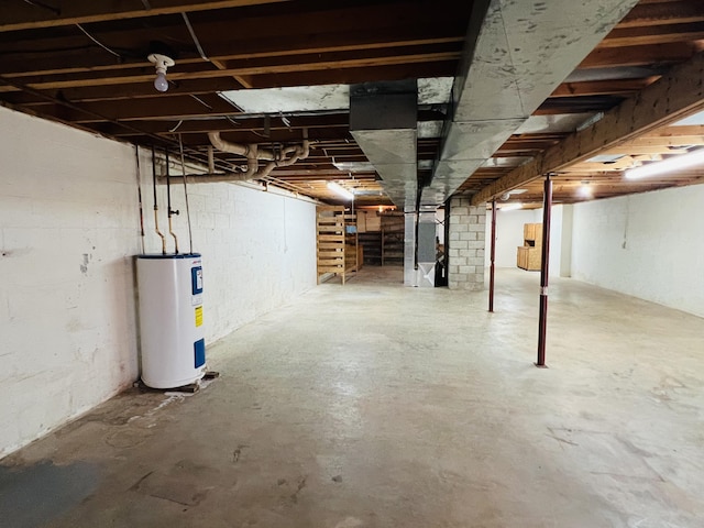 basement with heating unit and electric water heater