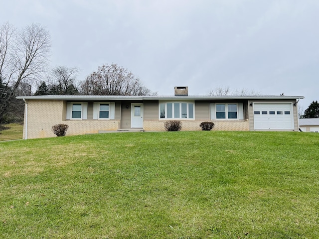 ranch-style house with a garage and a front lawn