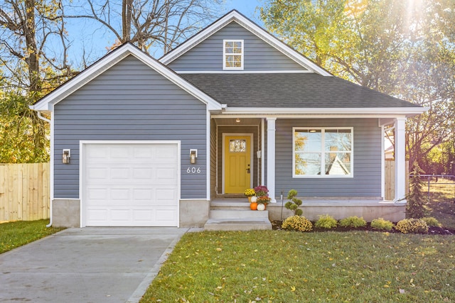 view of front of house with a garage and a front yard