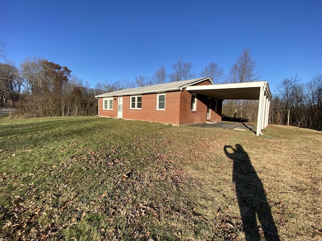 view of property exterior featuring a yard and a carport