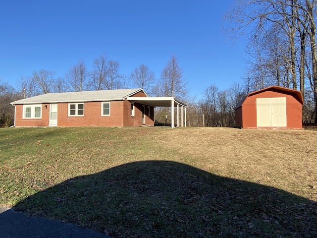 view of home's exterior featuring a lawn, a carport, and a shed