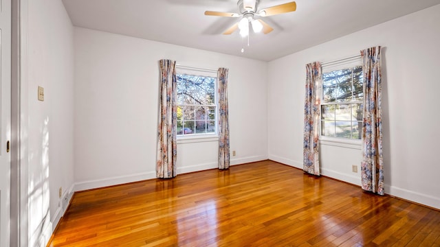 spare room featuring ceiling fan and hardwood / wood-style floors