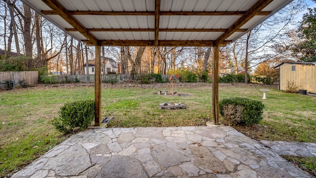 view of patio featuring a storage unit