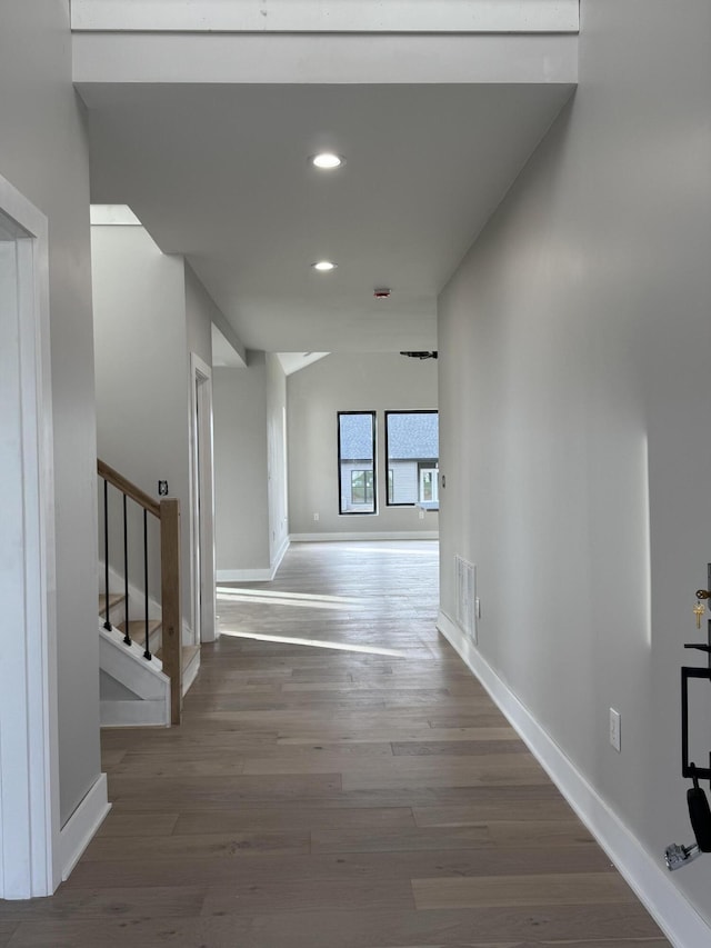 hall with hardwood / wood-style floors