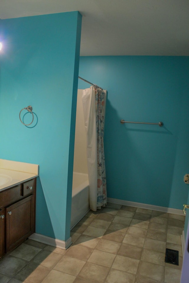 bathroom featuring vanity and shower / tub combo