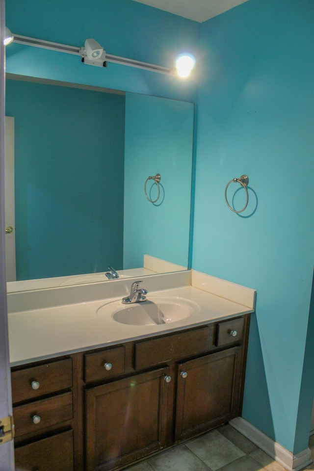 bathroom featuring tile patterned flooring and vanity