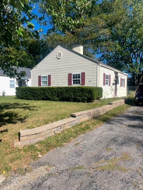 view of home's exterior with a lawn