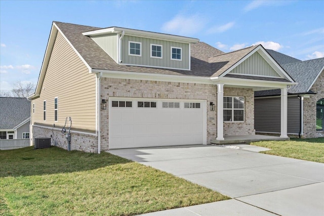 view of front facade featuring central AC, a front lawn, and a garage