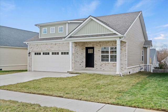 view of front of house featuring a front yard and a garage