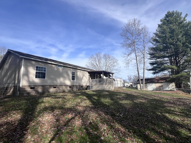 view of home's exterior with a yard