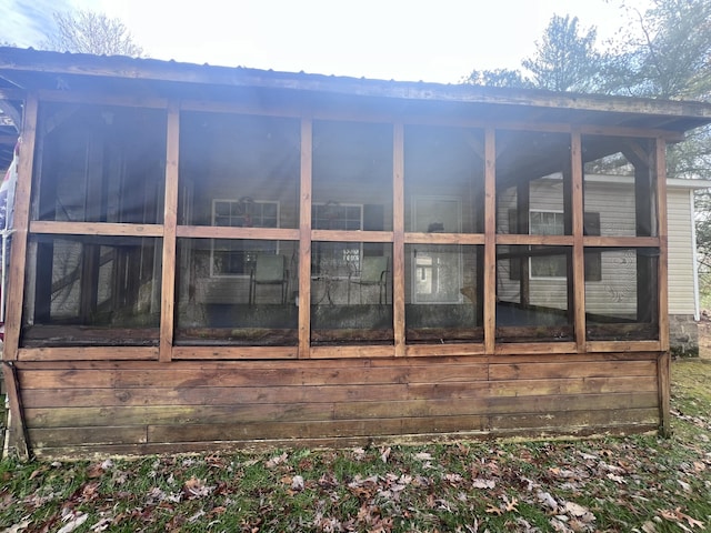 view of home's exterior with an outbuilding