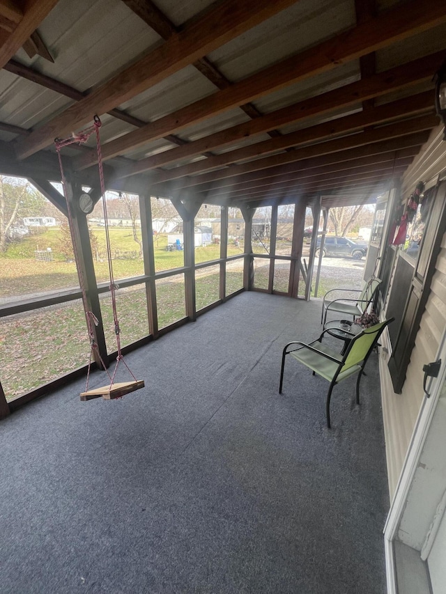 unfurnished sunroom featuring plenty of natural light