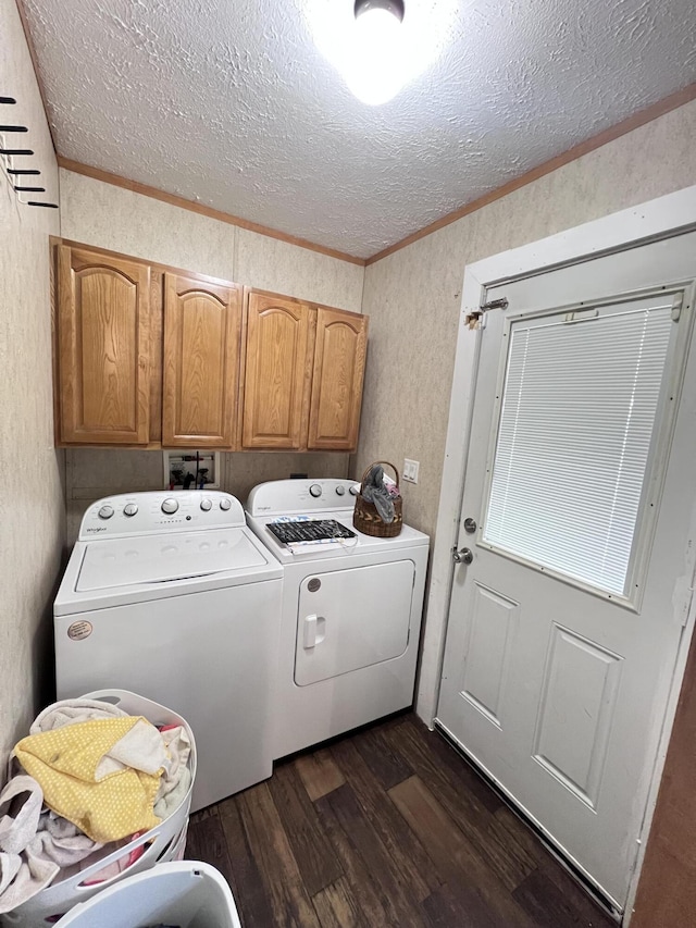 clothes washing area with dark hardwood / wood-style floors, cabinets, independent washer and dryer, and ornamental molding