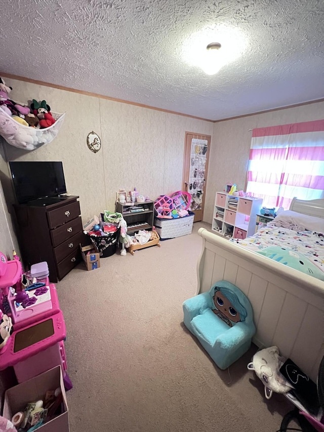 bedroom featuring carpet floors and a textured ceiling