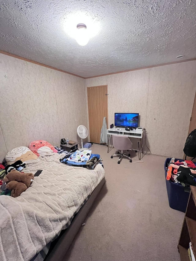 carpeted bedroom featuring a textured ceiling