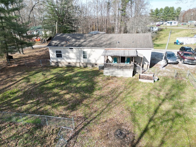 rear view of property with a lawn and a porch