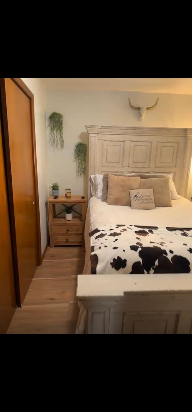 bedroom featuring hardwood / wood-style floors