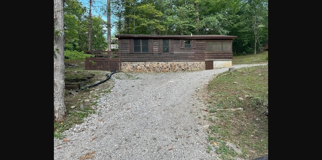 view of front of property with a wooden deck